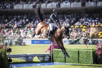 Mariano Martinez Bastida of Spain and riding Jup compete in the first round of the 1.60m CPKC