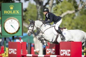 Irish rider Darragh Kenny riding VDL Cartello competes in the second round and jumpoff of the CPKC