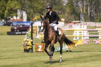 Vaclav Stanek from Czechoslovakia, and riding Quintin, compete in the 1.60m Grand Prix during The