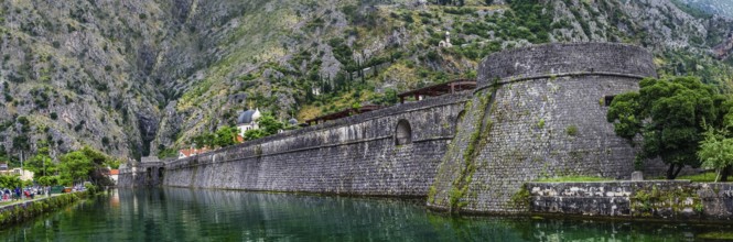 Panorama view on Kotor fortress at summer cloudy day, Kotor, Montenegro, Europe