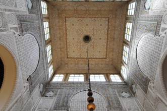 Meknes, Opulent vaulted ceiling with mosaic patterns and a hanging chandelier, Northern Morocco,