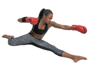 Beautiful young black woman wearing a pair of boxing gloves