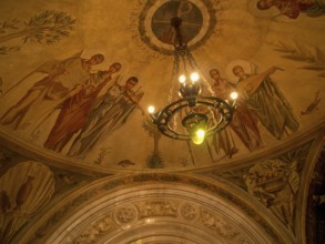 Ceiling frescoes with religious motifs and ornate details as well as lighting, montserrat, spain