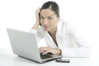 Modern businesswoman with white suit and laptop computer