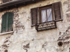 Old rustic house windows, antique architecture in Venetian style