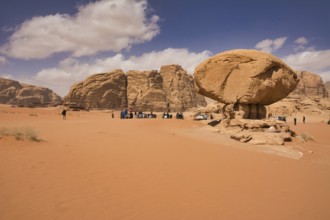 Wadi Rum desert, Jordan, March 2020: People gathering around Mushroom Rock in the Wadi Rum desert