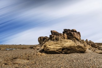 Rock formation against sky in Sillon de Talbert area in Brittany. Long exposure against moving