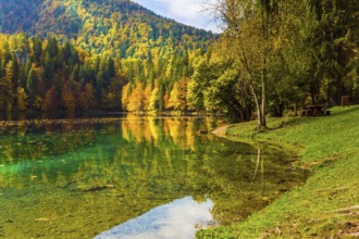 Flood after rain. The quiet lake in Northern Italy, Lago de Fusine. Concept of cultural and