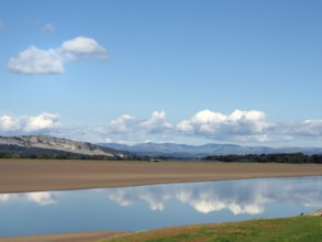 View of the river kent near arnside and sandside in cumbria with surrounding lakeland hills