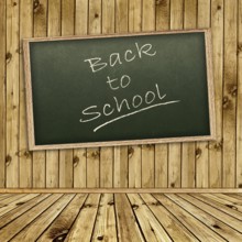 Empty school blackboard at wall in wooden interior
