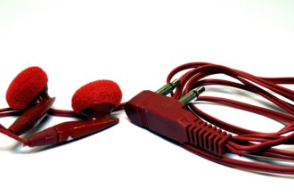 Earphones of red color for portable devices