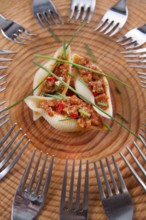 Presentation first plate of pasta shells with meat sauce and tomato