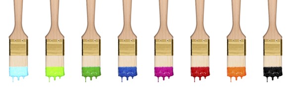 Colourful dropping set of paint brushes in a row isolated on white background