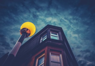 A Belisha Beacon Outside A Flat At Night In A Residential Area Of A British City