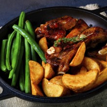 Pork with beans and quarter potatoes