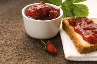 Wild strawberry jam with toast, poland