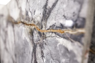 Detailed view of gray stone with a visible crack, stone, natural stone, stone structure