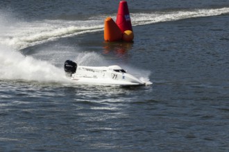 PESO DA REGUA, PORTUGAL - SEPTEMBER 15, 2024: White Powerboat Makes Sharp Turn with Splashes of