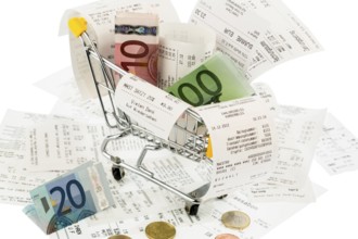 Shopping trolley, banknotes and receipts, symbolic photo for purchasing power, consumption and