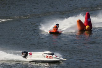 PESO DA REGUA, PORTUGAL - SEPTEMBER 15, 2024: Red and White Powerboats Go Fast with Splashes of