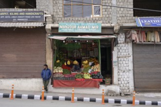 Leh, India, April 4, 2023: People at a fruit and vegetable shop in the historic city centre, Asia