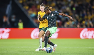 BRISBANE, AUSTRALIA, JULY 27: Caitlin FOORD of Australia and Christy UCHEIBE of Nigeria tackle as