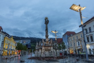 Evening atmosphere, rain clouds over the main square, plague column column, Leoben, Styria,