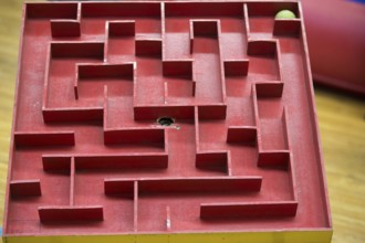 Wooden labyrinth with a ball