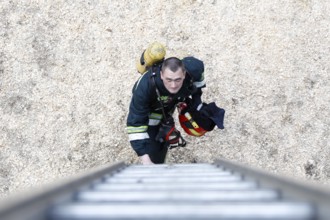 Belarus, Gomel, 04/06/2017, Extinguishing forest fire.Belarus.Firefighter will climb the stairs