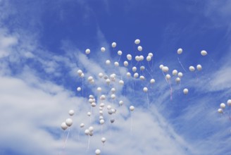 White balloons flying in clear blue sky
