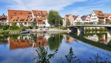 View of the riverside promenade in Rottenburg am Neckar with a punt