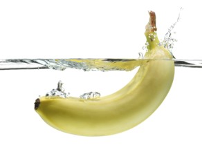 Banana splashing in clear water isolated on white