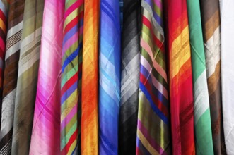 Fez, Hanging colourful textiles show a variety of patterns and materials, Northern Morocco,