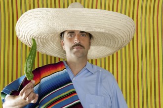 Chili hot pepper Mexican man typical poncho serape Mexico