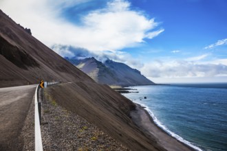 The main highway in Iceland on the Atlantic coast. The concept of extreme northern tourism. Summer