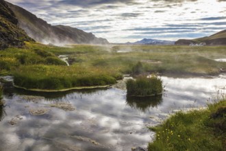 Sunrise Park Landmannalaugar. White nights in Iceland. Hot steam over the source of the thermal