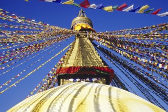 Bodnath Stupa in Nepal decorated with colourful flags