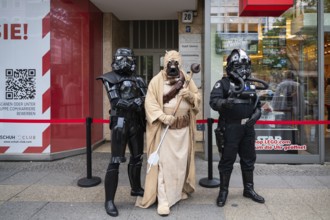 04.05.2024, Berlin, Germany, Europe, Star Wars fans in various costumes stand outside the Lego
