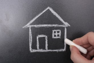 House drawn on blackboard. Sale, purchase, rent, real estate concept