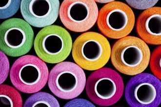 Sewing threads as a multicolored background close up