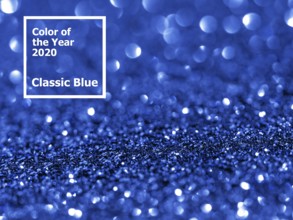 Sparkling background with bokeh made of Classic Blue 2020 color. Color of year 2020 blurred