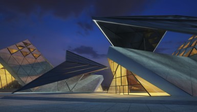 Contemporary triangle shape design modern Architecture building exterior with glass, concrete and