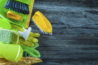 Dustpan brush washing objects on vintage wooden board