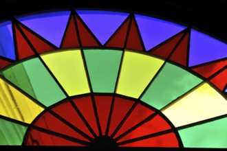 View of a colourful, wheel-shaped stained glass window with colourful segments, Havana, Cuba,
