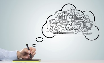 Hand of designer man working with tablet and business sketches at background