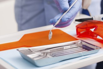 Dental instruments for test the oral cavity and doctor&#39, s hand close up
