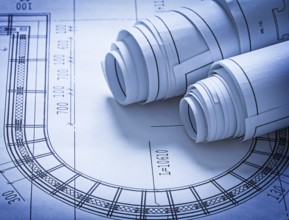 Rolled up construction blueprints building concept