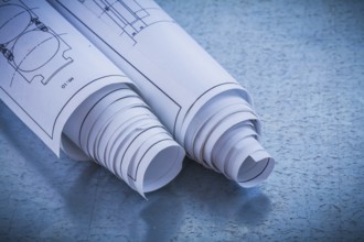 Close up image of construction plans on metallic background building and architecture concept