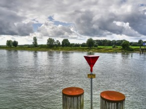 Vast river landscape under a dramatic sky, calm water and nature, zutphen, gelderland, achterhoek,
