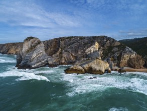 Aerial view on Atlantic coast with rock cliffs and waves in Portugal